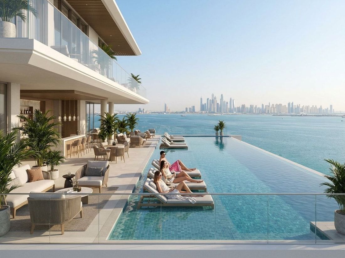 Basen infinity i dachowy sky lounge z widokiem na morze w Elle Residences